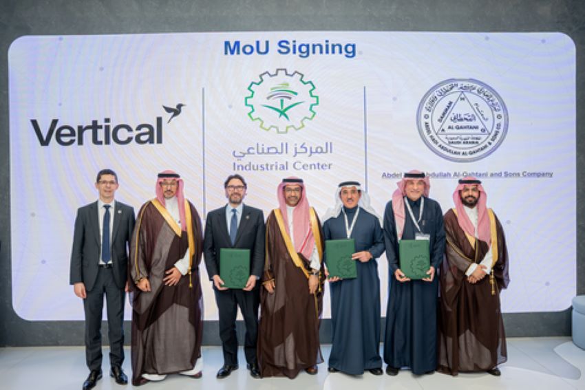 Futuristic electric vertical take-off and landing aircraft flying over modern Saudi Arabian cityscape