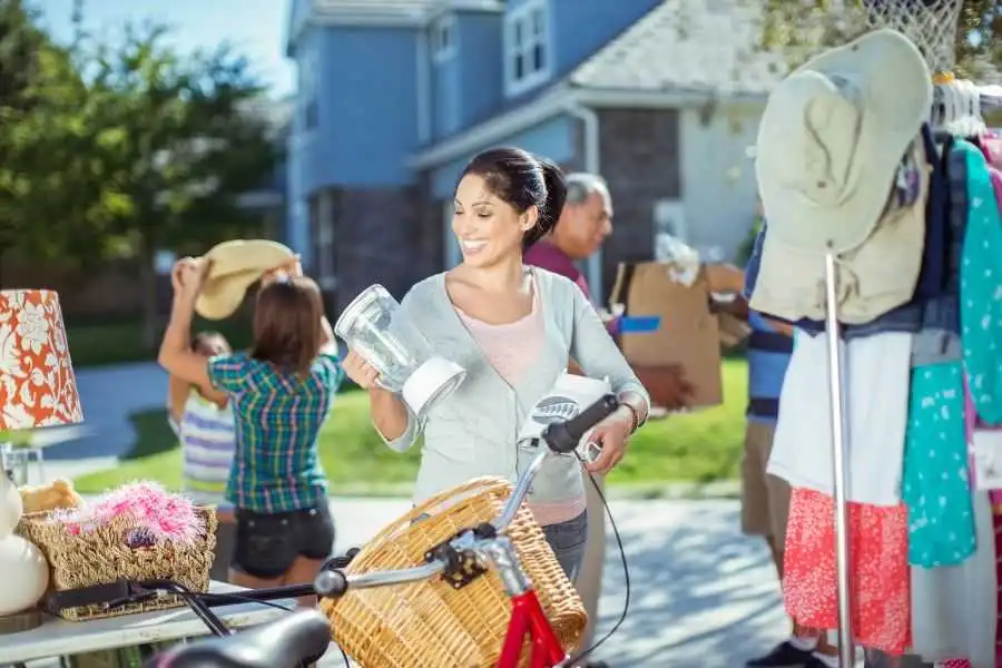 Neighbors exchanging household items and plants through a local Buy Nothing community group
