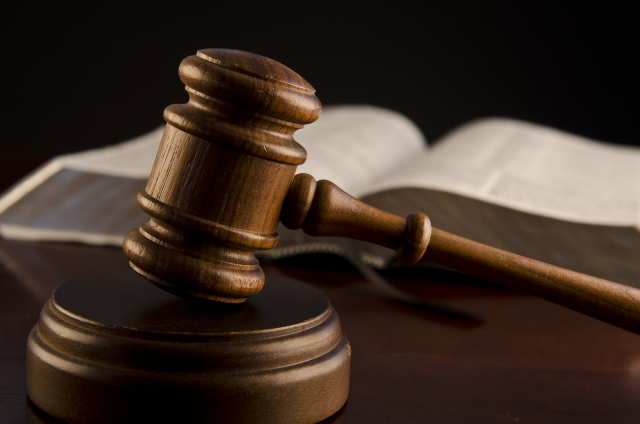 Veteran standing in courtroom during treatment court graduation ceremony in Lawrence County