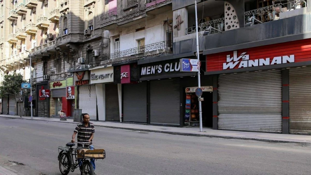 Busy Egyptian shopping mall with families browsing stores in the evening hours