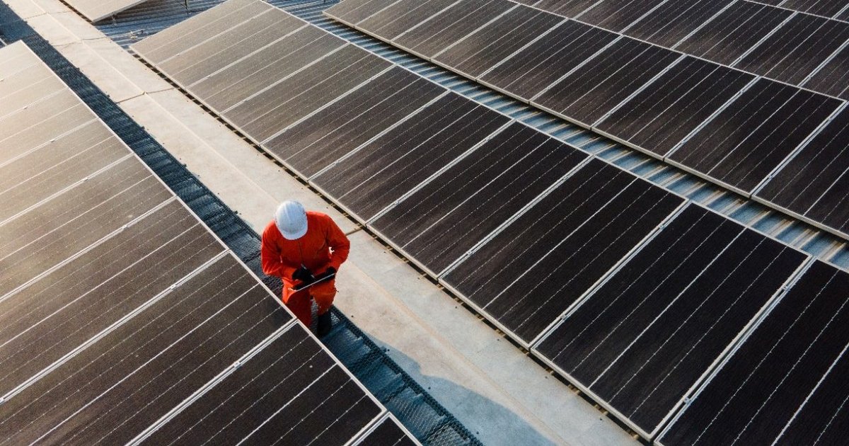 Aerial view of expansive solar panel arrays at Springwell Solar Farm site in Lincolnshire England