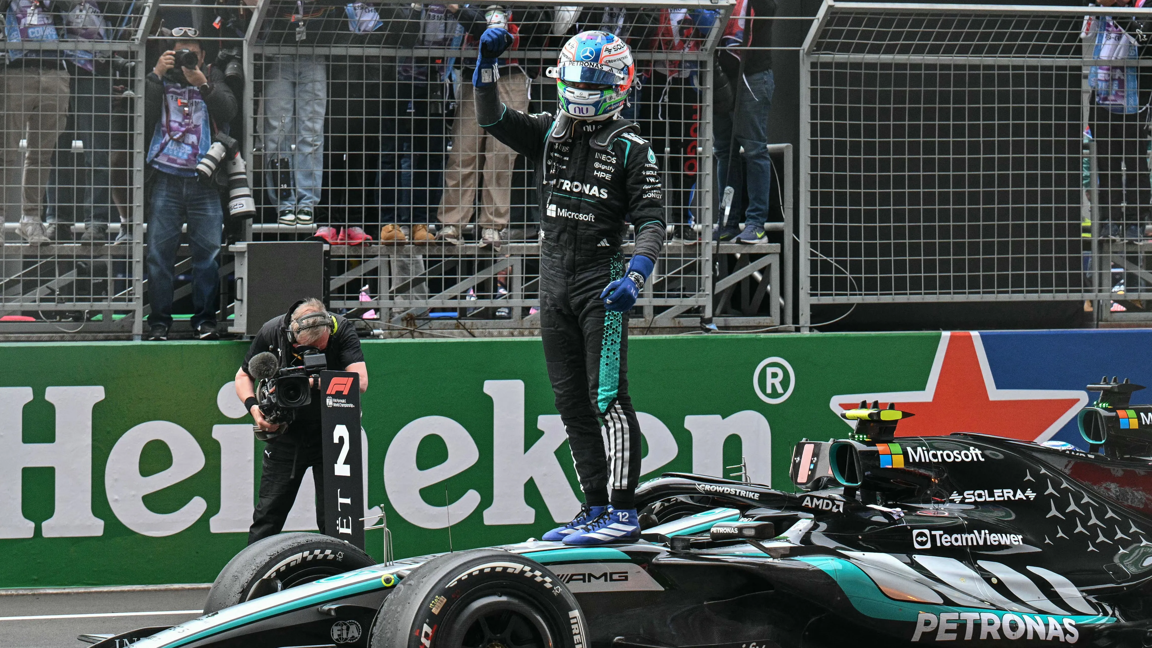 Young Italian F1 driver Kimi Antonelli celebrating his first Grand Prix victory on podium