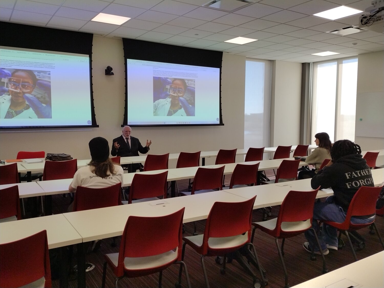 Professor teaching Applied Innovation course to engineering students in University of Houston Katy classroom