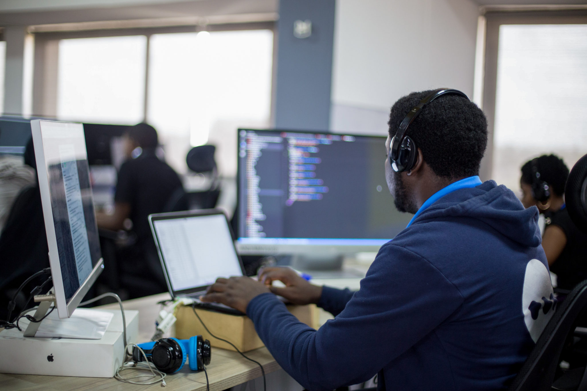 ** Andela logo displayed on computer screen showing global talent marketplace platform