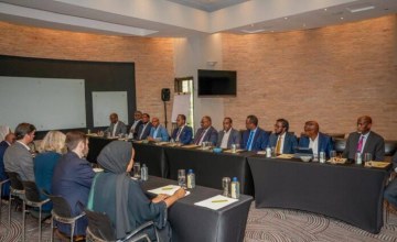 Somali health officials and international partners gathered at conference table in Nairobi discussing healthcare system improvements
