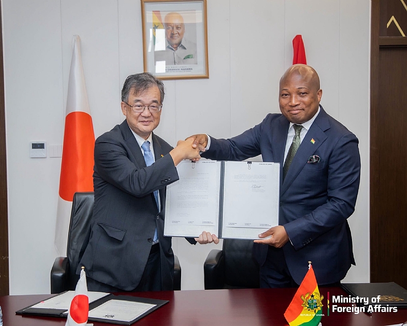 Ghanaian and Japanese officials shaking hands after signing healthcare grant agreement in Accra