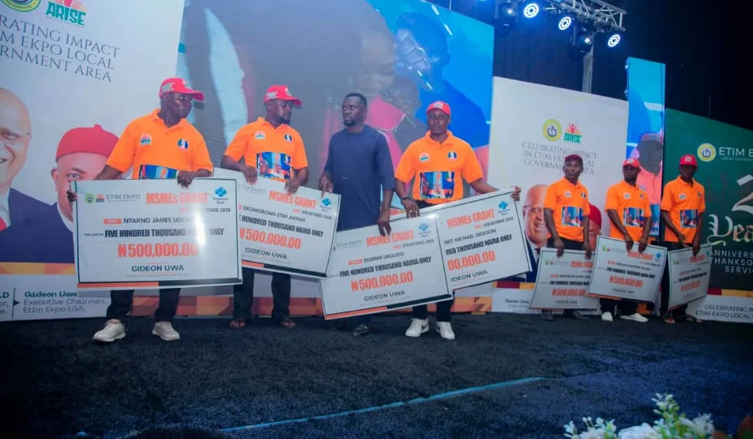 Young Nigerian entrepreneurs receiving business grant checks at local government celebration event