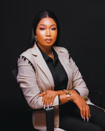 Nigerian photographer or videographer working with camera equipment at creative event