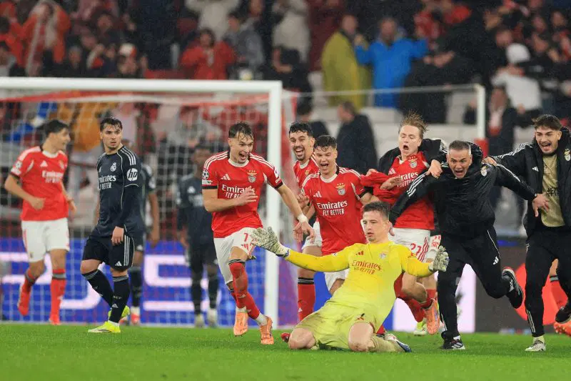 Benfica goalkeeper Anatoliy Trubin celebrating after scoring dramatic late header against Real Madrid
