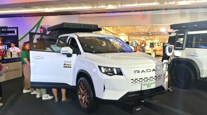 White Radar RD6 electric pickup truck displayed at automotive showcase in the Philippines