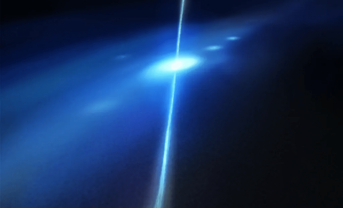 NASA illustration showing two neutron stars colliding inside a small distant galaxy