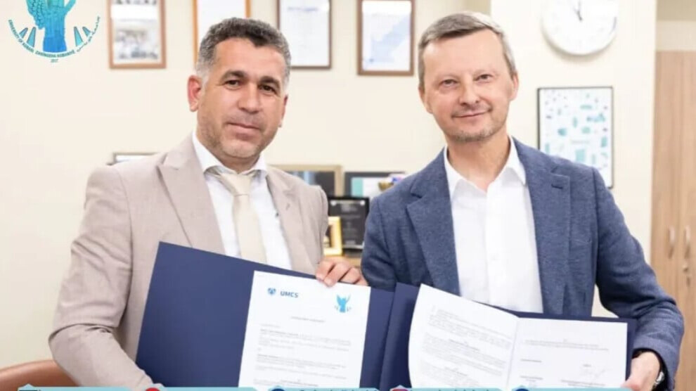 University officials from Syria and Poland signing academic partnership agreement at ceremony