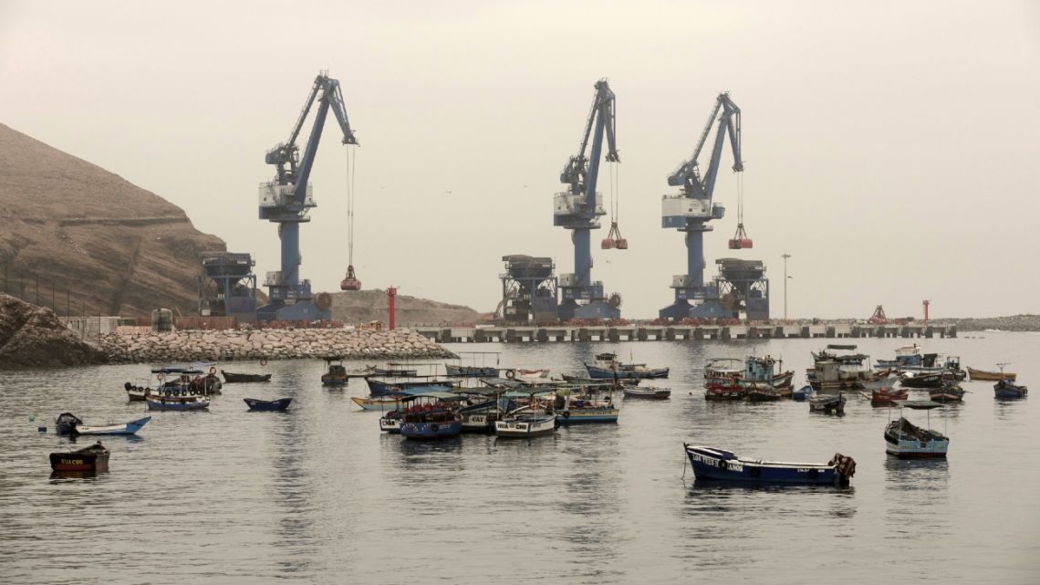 Container ships at Latin American port loading commodities for export to international markets