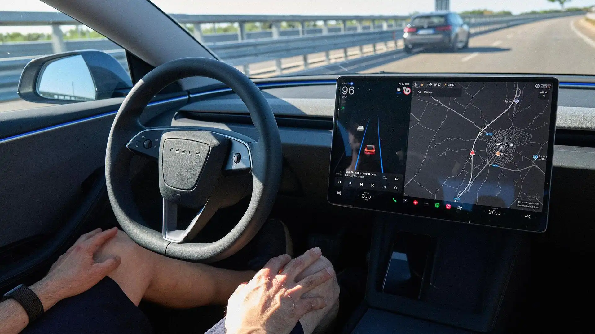 Tesla vehicle driving on Dutch highway with self-driving technology enabled under supervision