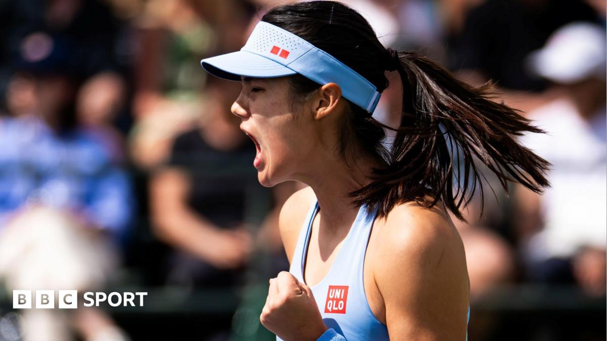 Emma Raducanu smiling and waving to crowd after winning her Indian Wells tennis match