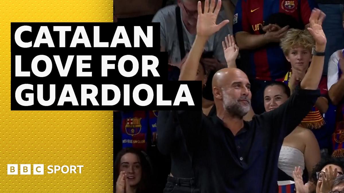 Pep Guardiola at Barcelona basketball game receiving standing ovation from crowd