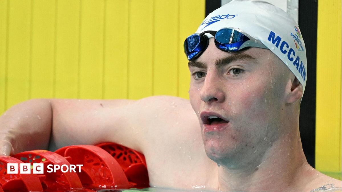 Swimmer Sean McCann competing in freestyle race at Commonwealth Games in Glasgow