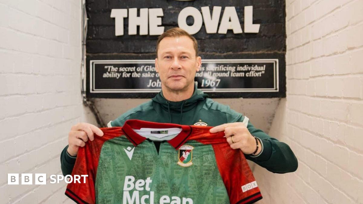 Duncan Ferguson in Glentoran coaching gear smiling at Belfast club's training facility