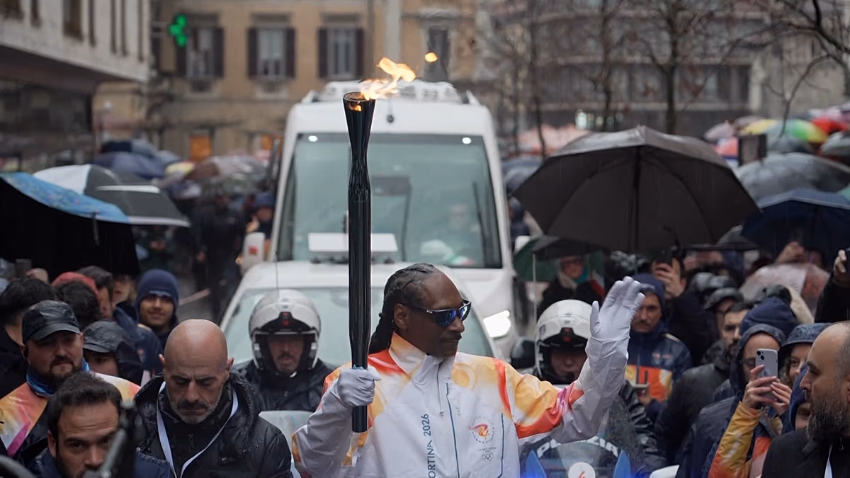 Snoop Dogg Carries Olympic Torch Through Italian Streets