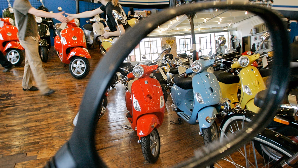 Classic Italian Vespa scooter with distinctive curved body and chrome details