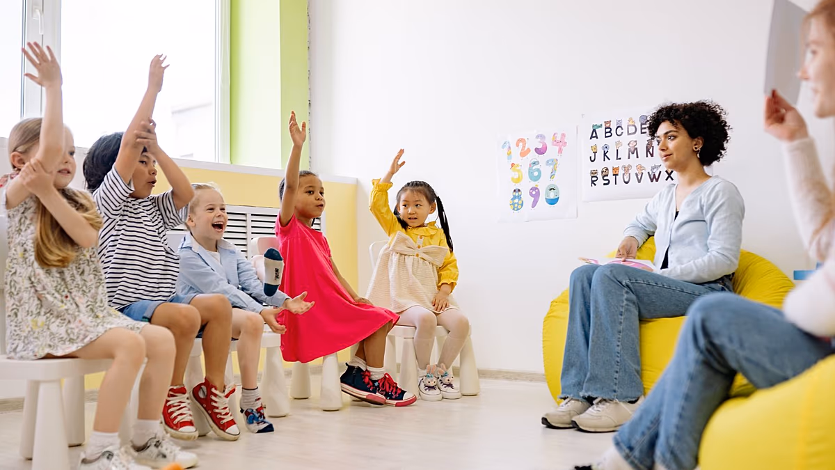 Young child learning self-care skills with caregiver in early childhood development setting