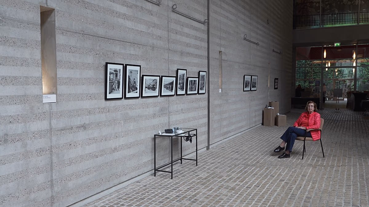 Historical black and white photographs showing Jewish men during 1941 Paris roundup displayed at exhibition