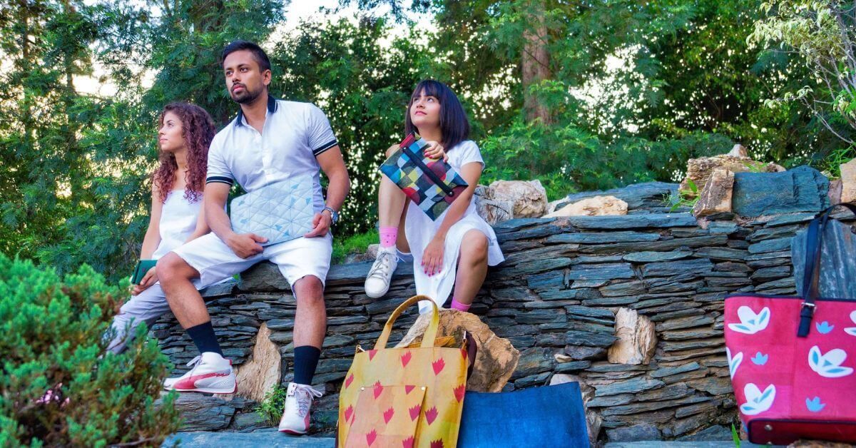 Colorful tote bags and accessories made from upcycled plastic waste displayed by Lifaffa brand