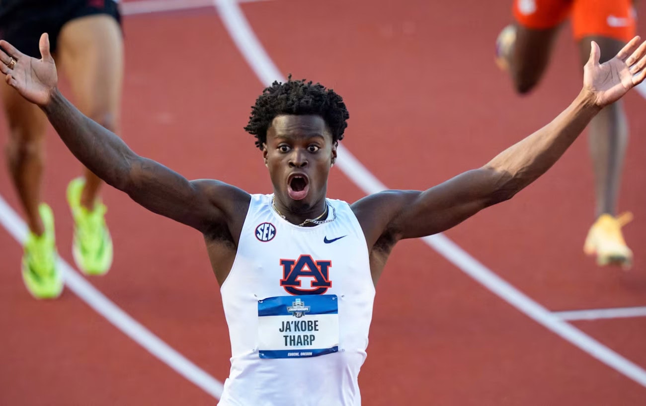 Auburn sophomore Ja'Kobe Tharp clearing hurdles during his world record 110-meter dash