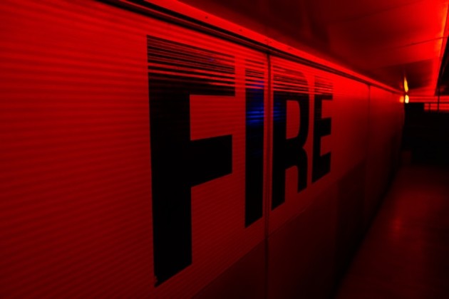 St. Cloud firefighters in protective gear responding to house fire emergency scene