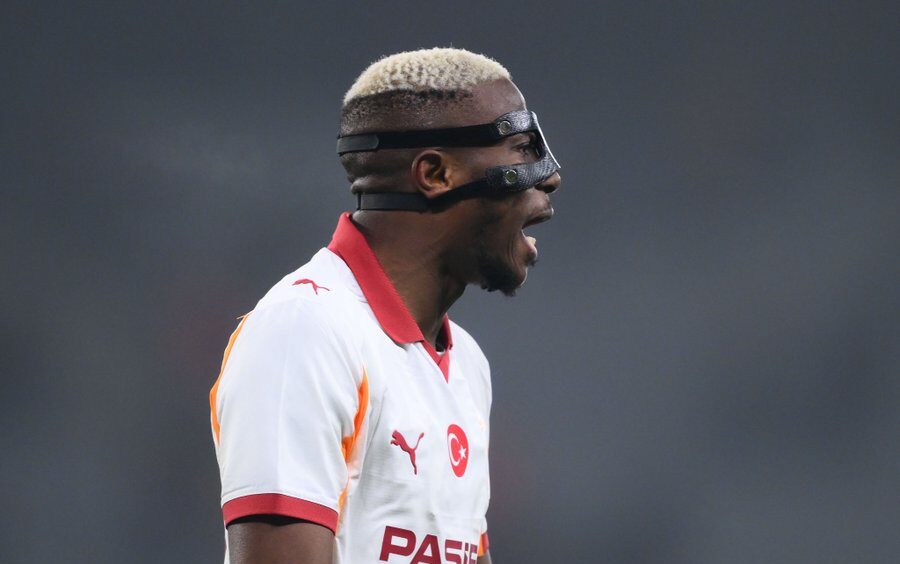 Victor Osimhen celebrating a goal in Galatasaray's red and yellow jersey during Champions League match
