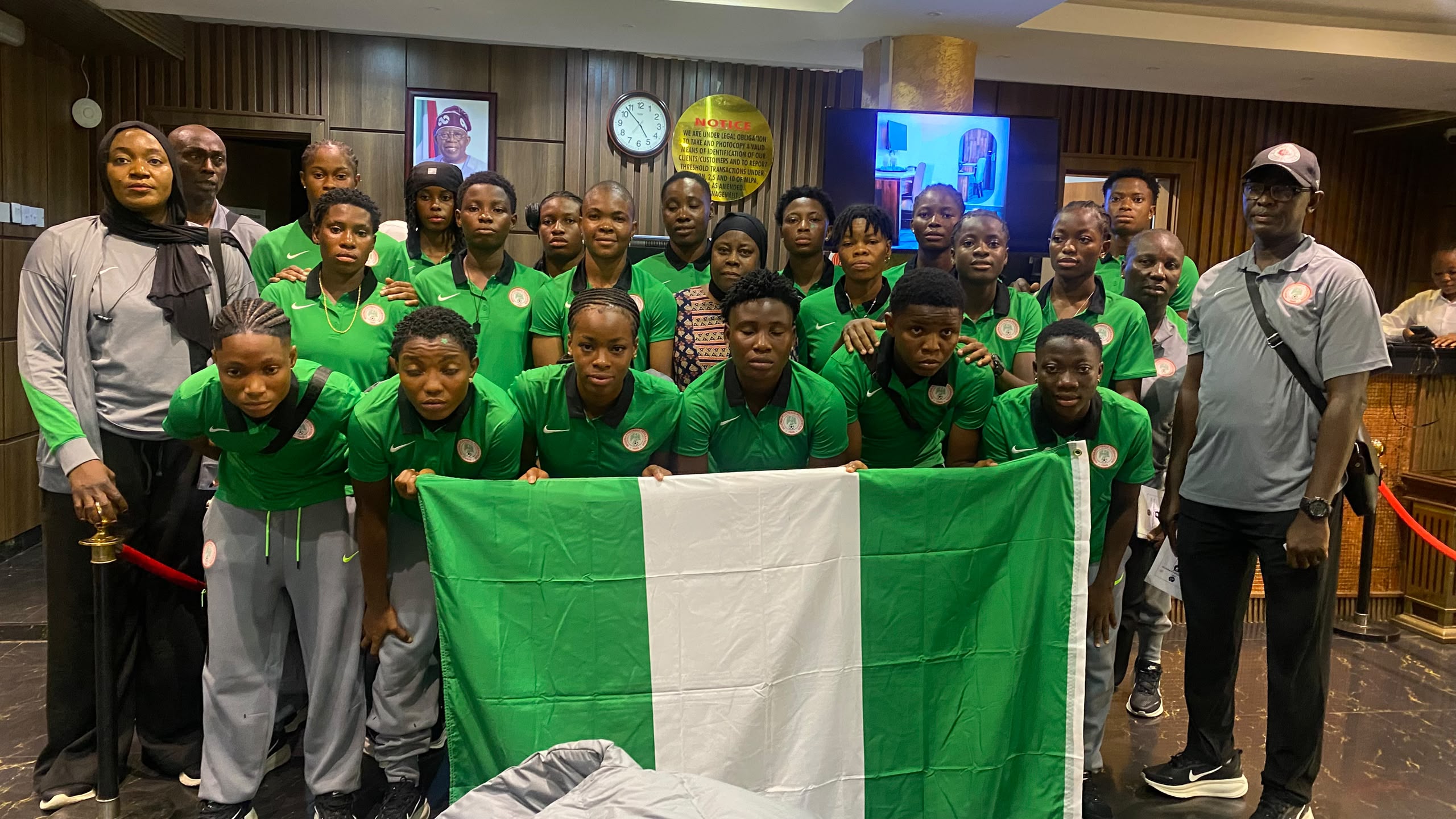 Nigeria's Falconets women's football team celebrating together in their green national jerseys