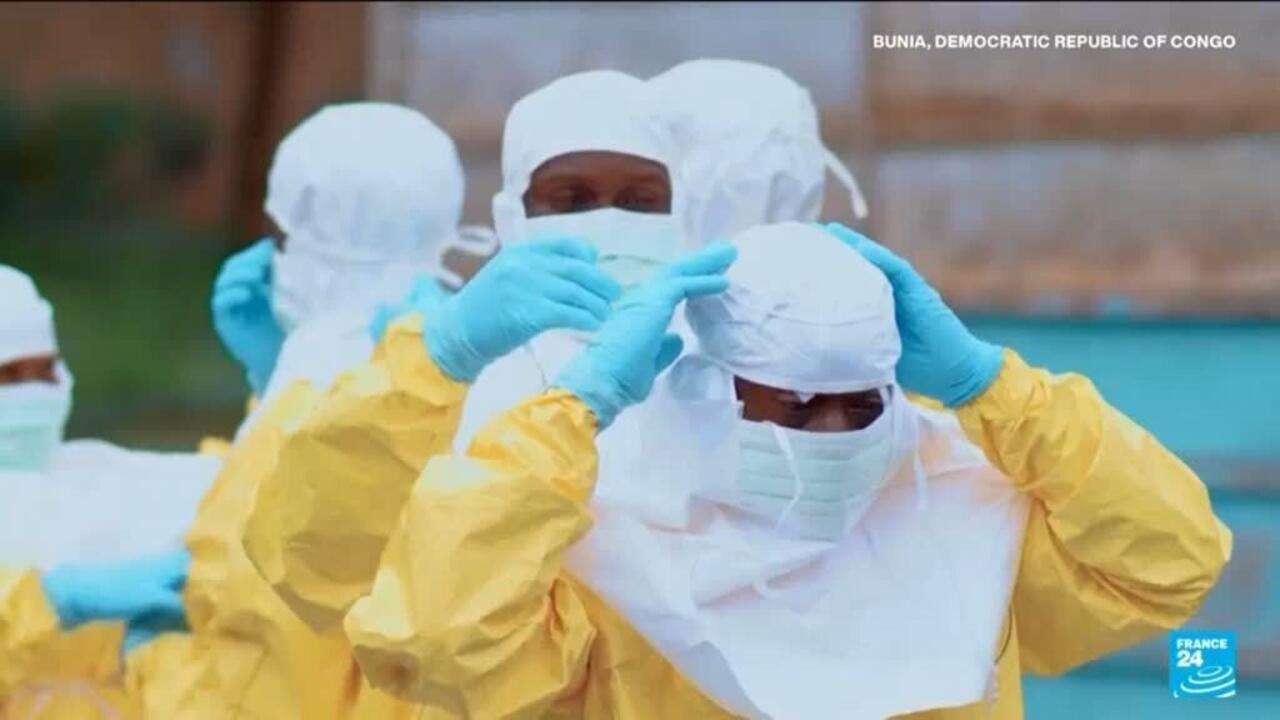Healthcare workers in protective gear treating Ebola patients in Democratic Republic of Congo hospital