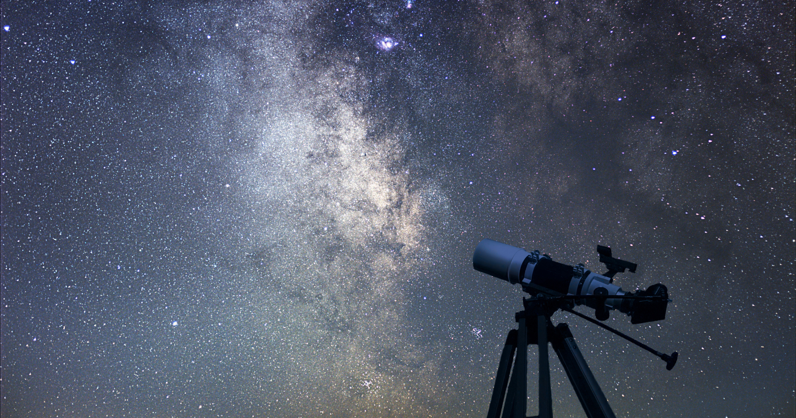 Night sky filled with stars above a coastal Russian village at twilight