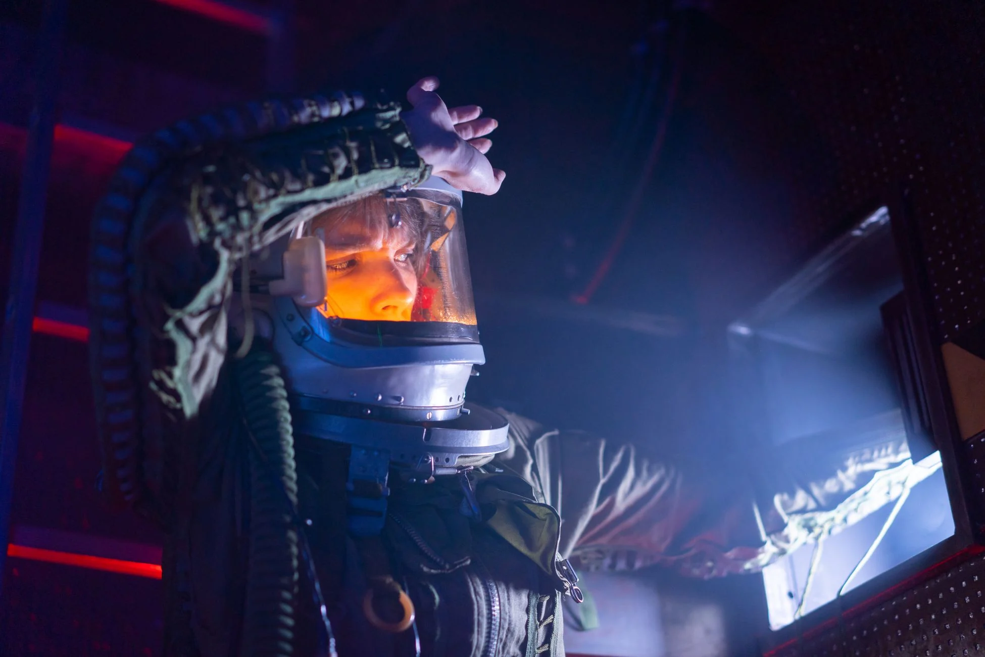 Astronaut stepping out of spacecraft onto Earth after long-duration space mission
