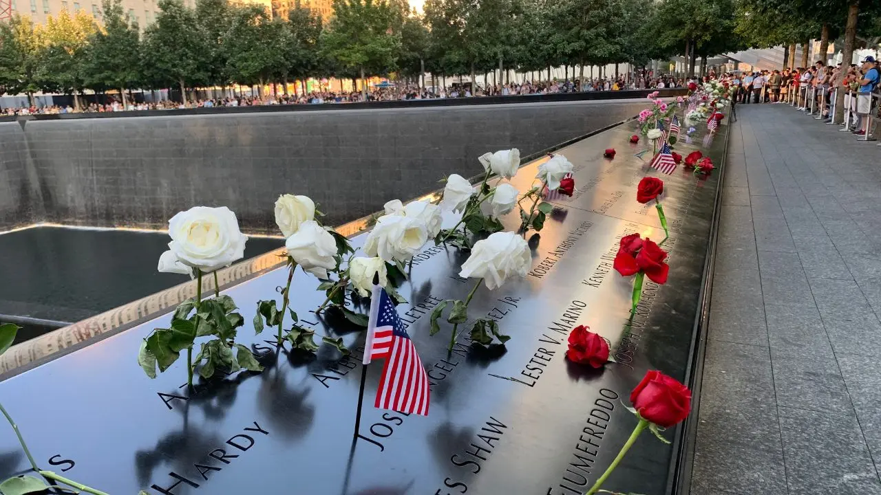 Visitors reflecting at the 9/11 Memorial reflecting pools in Lower Manhattan, New York