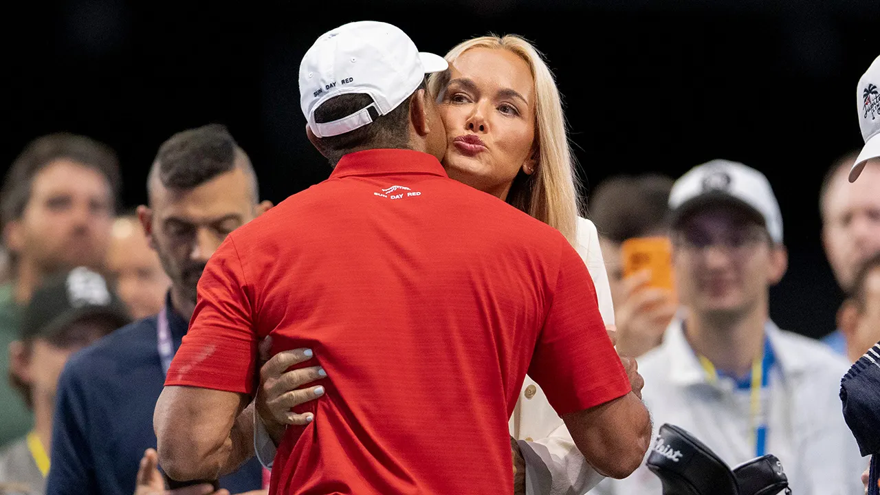 ** Vanessa Trump and Tiger Woods embracing at golf event in Palm Beach Gardens Florida
