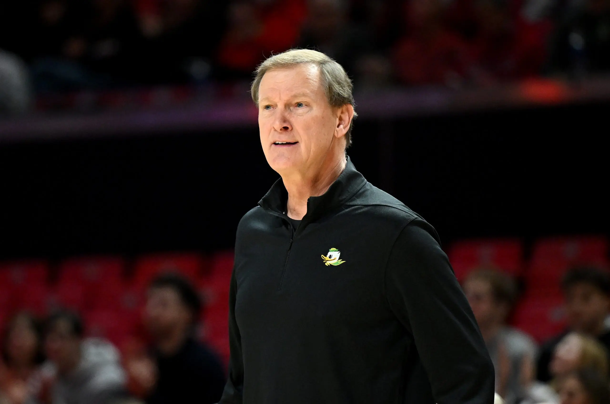 Oregon Ducks head coach Dana Altman watching from the sideline during a basketball game