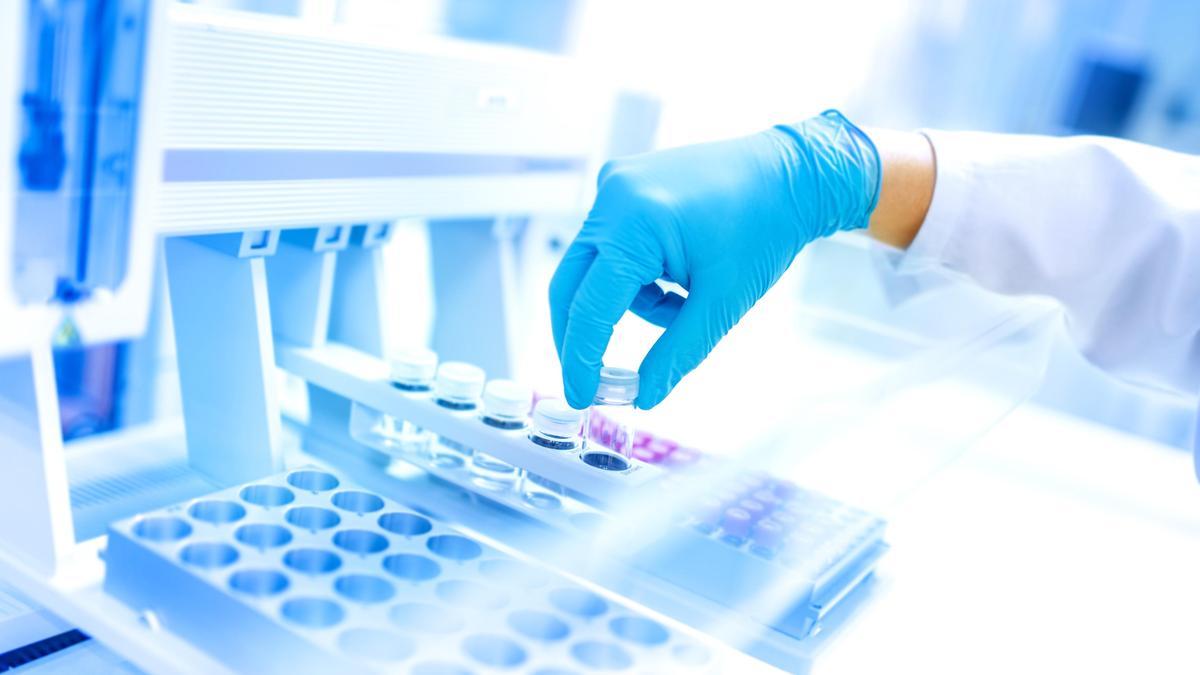 Senior woman smiling during blood test appointment with healthcare professional in bright medical office