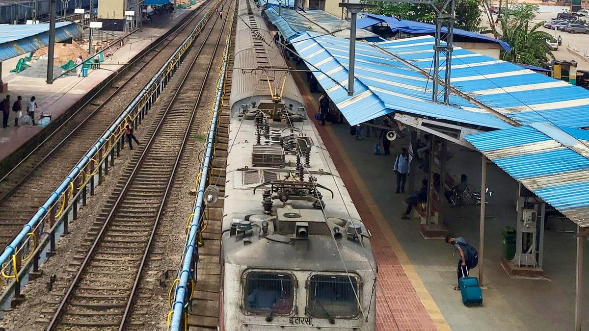 Indian passenger train traveling along coastal railway route connecting Surat and Mangaluru