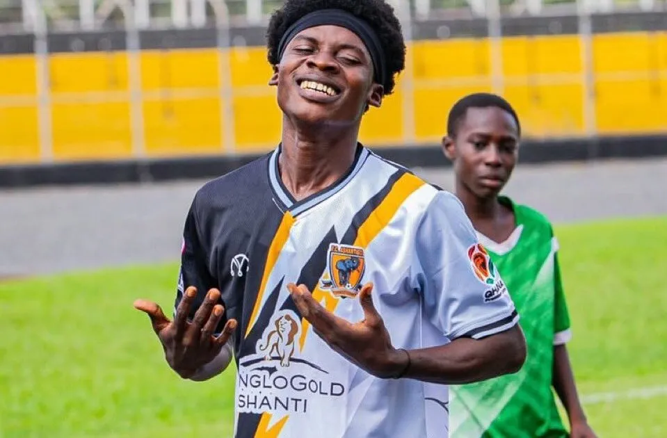 Soccer player David Gyamfi celebrating on field after scoring hat-trick for FC Ashantigold