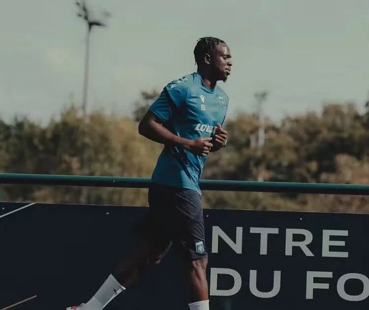 Ghana defender Marvin Senaya training on grass field during injury recovery for AJ Auxerre