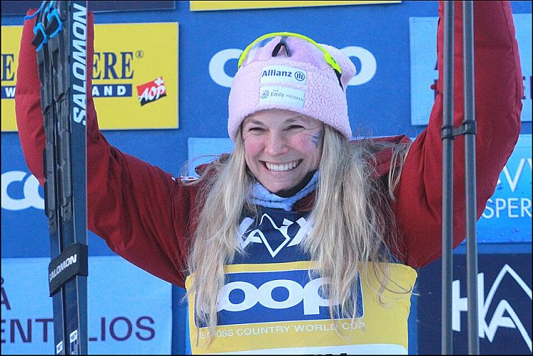 ** Jessie Diggins competing in cross-country skiing race wearing Team USA uniform