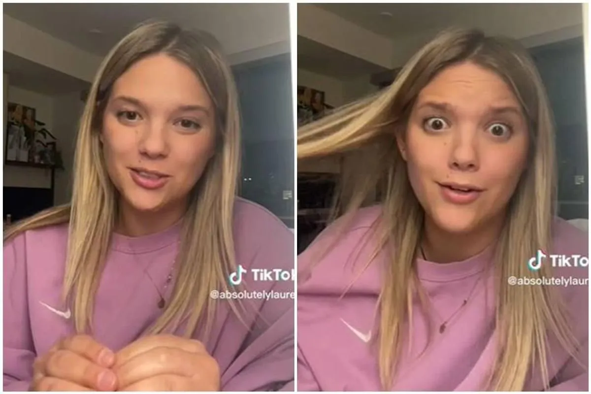 Woman looking at smartphone checking credit card fraud alert notification on mobile banking app